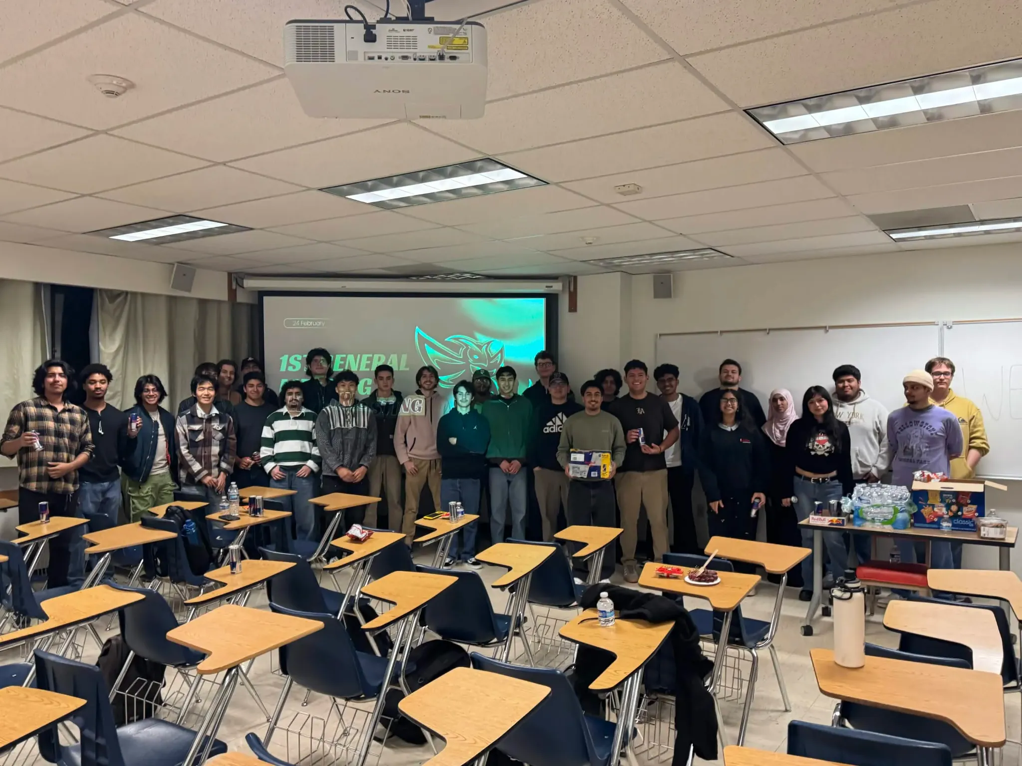 Electric Sting Racing members gathered in a classroom during a team meeting.